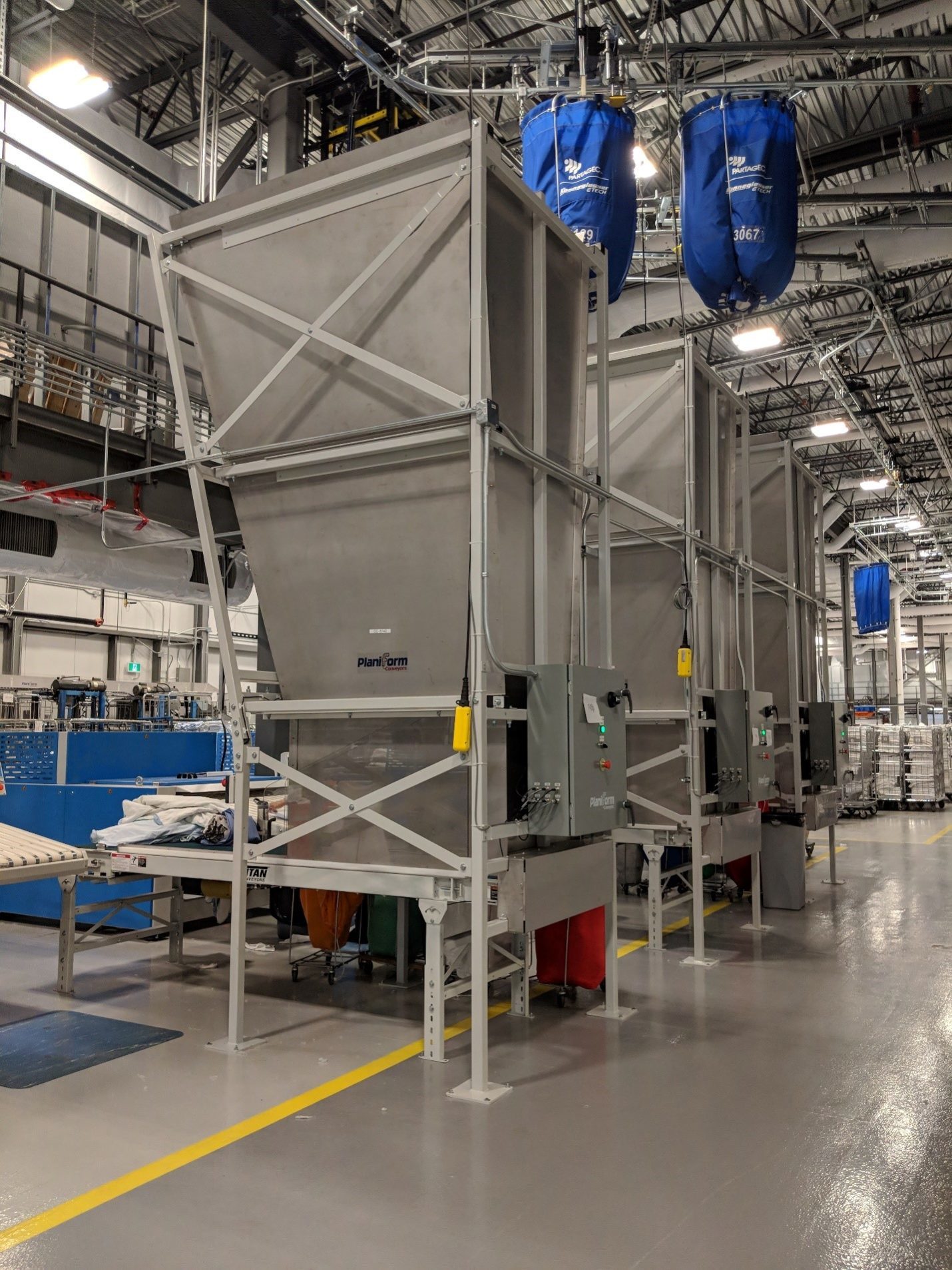 Industrial Laundry Conveyor System Installation for Canadian Hospital