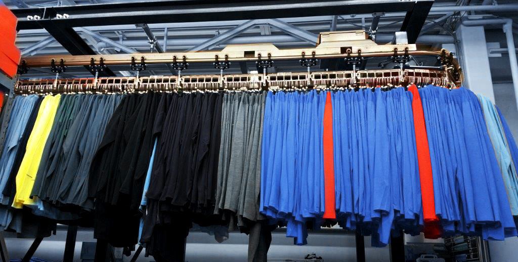 Hangers With Clothes On Garment Conveyor At Dry-cleaner's Stock Photo,  Picture and Royalty Free Image. Image 198000170.